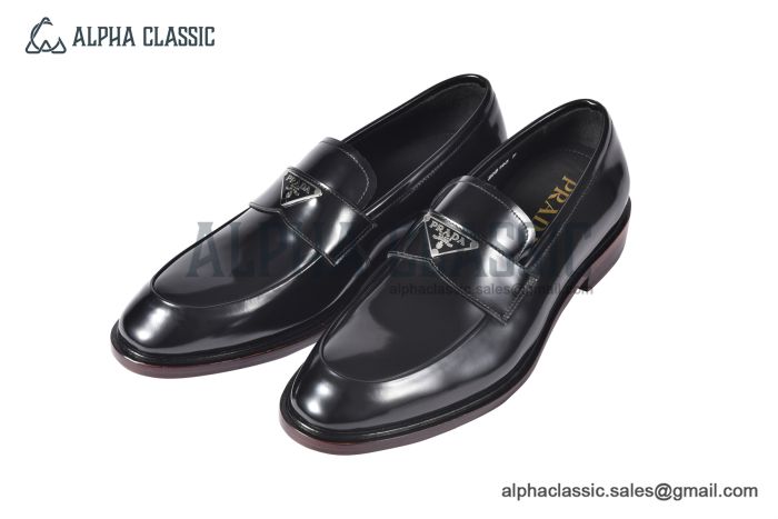 Prada Black Brushed Calfskin Loafers with the Iconic Enameled Metal Triangle Logo