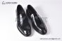 Prada Black Brushed Calfskin Loafers with the Iconic Enameled Metal Triangle Logo