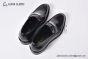 Prada Black Brushed Calfskin Loafers with the Iconic Enameled Metal Triangle Logo