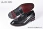 Prada Black Brushed Calfskin Loafers with the Iconic Enameled Metal Triangle Logo