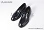 Prada Black Brushed Calfskin Loafers with the Iconic Enameled Metal Triangle Logo