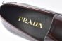 Prada Red Calfskin Loafers with the Iconic Enameled Metal Triangle Logo