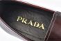 Prada Red Brushed Calfskin Loafers with the Logo-engraved Enameled Metal Bit Ornament