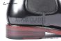 Prada Classic Brushed Black Calfskin Boot with the Triangle-embossed Logo