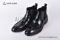 Prada Classic Brushed Black Calfskin Boot with the Iconic Enameled Metal Triangle Logo
