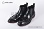 Prada Classic Brushed Black Calfskin Boot with the Iconic Enameled Metal Triangle Logo