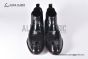 Prada Classic Brushed Black Calfskin Boot with the Iconic Enameled Metal Triangle Logo