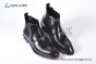 Prada Classic Brushed Black Calfskin Boot with the Iconic Enameled Metal Triangle Logo