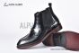 Prada Classic Brushed Black Calfskin Boot with the Iconic Enameled Metal Triangle Logo
