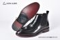 Prada Classic Brushed Black Calfskin Boot with the Iconic Enameled Metal Triangle Logo
