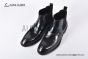 Prada Classic Brushed Black Calfskin Boot with the Iconic Enameled Metal Triangle Logo