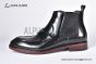 Prada Classic Brushed Black Calfskin Boot with the Iconic Enameled Metal Triangle Logo