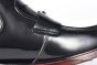Prada Classic Brushed Black Calfskin Boot with the Iconic Enameled Metal Triangle Logo
