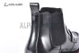 Prada Classic Brushed Black Calfskin Boot with the Iconic Enameled Metal Triangle Logo