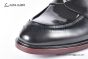 Prada Classic Brushed Black Calfskin Boot with the Iconic Enameled Metal Triangle Logo