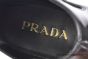 Prada Classic Brushed Black Calfskin Boot with the Iconic Enameled Metal Triangle Logo