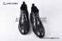 Prada Classic Brushed Matte Black Calfskin Boot with the Iconic Enameled Metal Triangle Logo