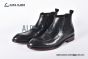 Prada Classic Brushed Matte Black Calfskin Boot with the Iconic Enameled Metal Triangle Logo
