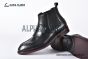 Prada Classic Brushed Matte Black Calfskin Boot with the Iconic Enameled Metal Triangle Logo