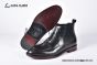 Prada Classic Brushed Matte Black Calfskin Boot with the Iconic Enameled Metal Triangle Logo
