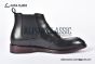 Prada Classic Brushed Matte Black Calfskin Boot with the Iconic Enameled Metal Triangle Logo