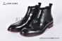 Prada Classic Black Calfskin Boot with the Iconic Enameled Metal Triangle Logo