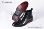 Prada Classic Black Calfskin Boot with the Iconic Enameled Metal Triangle Logo