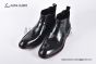 Prada Classic Black Calfskin Boot with the Iconic Enameled Metal Triangle Logo