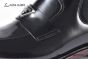 Prada Classic Black Calfskin Boot with the Iconic Enameled Metal Triangle Logo
