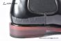 Prada Classic Black Calfskin Boot with the Iconic Enameled Metal Triangle Logo