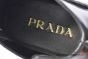 Prada Classic Black Calfskin Boot with the Iconic Enameled Metal Triangle Logo