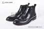 Prada Classic Smooth Black Calfskin Boot with the Iconic Enameled Metal Triangle Logo