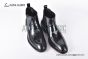 Prada Classic Smooth Black Calfskin Boot with the Iconic Enameled Metal Triangle Logo