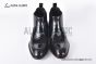 Prada Classic Smooth Black Calfskin Boot with the Iconic Enameled Metal Triangle Logo