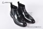 Prada Classic Smooth Black Calfskin Boot with the Iconic Enameled Metal Triangle Logo