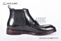 Prada Classic Smooth Black Calfskin Boot with the Iconic Enameled Metal Triangle Logo
