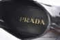 Prada Classic Smooth Black Calfskin Boot with the Iconic Enameled Metal Triangle Logo