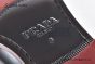 Prada Classic Smooth Black Calfskin Boot with the Iconic Enameled Metal Triangle Logo