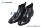 Prada Classic Smooth Matte Black Calfskin Boot with the Iconic Enameled Metal Triangle Logo