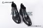 Prada Classic Smooth Matte Black Calfskin Boot with the Iconic Enameled Metal Triangle Logo