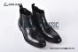 Prada Classic Smooth Matte Black Calfskin Boot with the Iconic Enameled Metal Triangle Logo