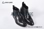 Prada Classic Smooth Matte Black Calfskin Boot with the Iconic Enameled Metal Triangle Logo