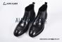 Prada Classic Smooth Matte Black Calfskin Boot with the Iconic Enameled Metal Triangle Logo