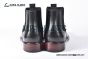 Prada Classic Smooth Matte Black Calfskin Boot with the Iconic Enameled Metal Triangle Logo