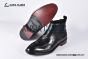 Prada Classic Smooth Matte Black Calfskin Boot with the Iconic Enameled Metal Triangle Logo