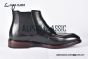 Prada Classic Smooth Matte Black Calfskin Boot with the Iconic Enameled Metal Triangle Logo