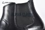 Prada Classic Smooth Matte Black Calfskin Boot with the Iconic Enameled Metal Triangle Logo