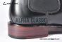 Prada Classic Smooth Matte Black Calfskin Boot with the Iconic Enameled Metal Triangle Logo