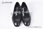 Ferragamo Black Calfskin Moccasin with Gancini Ornament and Unique Sutures